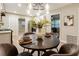 Charming dining room with a stylish chandelier, seating for four, and easy access to the kitchen at 2775 Belleau Se Ln, Atlanta, GA 30316