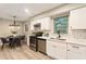 Modern kitchen showcasing stainless steel appliances, white cabinets, and an adjacent dining area at 2775 Belleau Se Ln, Atlanta, GA 30316