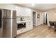 Well-equipped kitchen with stainless steel appliances, white cabinets, and an open layout leading to the dining area at 2775 Belleau Se Ln, Atlanta, GA 30316
