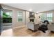Inviting living room with fireplace, modern furniture, and an open doorway to the outside at 2775 Belleau Se Ln, Atlanta, GA 30316