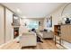 Stylish living room with a fireplace, hardwood floors, modern furniture, and plenty of natural light at 2775 Belleau Se Ln, Atlanta, GA 30316