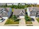 Aerial view showcasing the property with a well-maintained lawn, driveway, and neighborhood at 5318 Burrus Ln, Mableton, GA 30126
