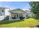 Spacious backyard with a covered patio for outdoor living, and a well-maintained lawn at 5318 Burrus Ln, Mableton, GA 30126