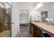 Bathroom with a glass shower door and granite countertops with access to a bedroom at 5318 Burrus Ln, Mableton, GA 30126