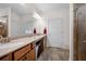 Bathroom featuring double sink vanity with hard surface counter and tile floor at 5318 Burrus Ln, Mableton, GA 30126