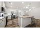 Bright kitchen with granite countertops, stainless steel appliances, and island seating at 5318 Burrus Ln, Mableton, GA 30126
