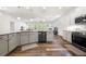 Modern kitchen with granite counters, stainless appliances, and open layout to living area at 5318 Burrus Ln, Mableton, GA 30126