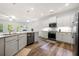 Spacious kitchen with stainless appliances, granite countertops, and view to living area at 5318 Burrus Ln, Mableton, GA 30126