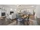 Open-concept living and kitchen area features hardwood floors, fireplace, and modern decor at 5318 Burrus Ln, Mableton, GA 30126
