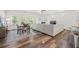 Spacious living area features a dining set, hardwood floors, a cozy fireplace, and large sectional at 5318 Burrus Ln, Mableton, GA 30126