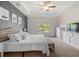 Bright main bedroom with large window, neutral carpet, and ample dresser storage at 5318 Burrus Ln, Mableton, GA 30126