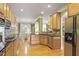 Open kitchen with stainless steel appliances, granite counters, and views to dining area at 1605 Pavillion Ridge Se Dr, Smyrna, GA 30080