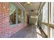 Inviting screened porch with brick accents, providing a tranquil outdoor space at 1605 Pavillion Ridge Se Dr, Smyrna, GA 30080