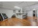 The basement features a bar with stools and wood floors at 162 Nouveau Sw Ct, Lilburn, GA 30047