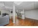 The spacious basement has a bar area, wood floors, and a gray couch at 162 Nouveau Sw Ct, Lilburn, GA 30047
