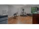 Basement music room features a drum set, piano, and wood laminate floors at 162 Nouveau Sw Ct, Lilburn, GA 30047