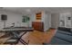 Basement music room features a piano, drum set, and wood laminate floors at 162 Nouveau Sw Ct, Lilburn, GA 30047
