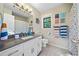Bathroom featuring a large vanity area, decorative artwork, and tile flooring at 162 Nouveau Sw Ct, Lilburn, GA 30047