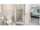 Bathroom showcasing a tiled walk-in shower and a separate toilet area for added privacy at 162 Nouveau Sw Ct, Lilburn, GA 30047
