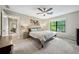 Bedroom showcasing natural light from the large window with a ceiling fan at 162 Nouveau Sw Ct, Lilburn, GA 30047