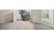 Bedroom features a desk area with two monitors, a file cabinet, and grey carpet at 162 Nouveau Sw Ct, Lilburn, GA 30047