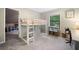 Bedroom showcasing a bunk bed with attached study space and ample lighting at 162 Nouveau Sw Ct, Lilburn, GA 30047