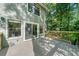 Spacious deck with sliding glass doors offers seamless indoor-outdoor living and beautiful wooded views at 162 Nouveau Sw Ct, Lilburn, GA 30047