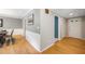 Traditional hallway with hardwood floors, neutral colored walls and white trims throughout the home at 162 Nouveau Sw Ct, Lilburn, GA 30047