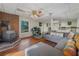 Open floor plan living room features a brick fireplace and a comfortable gray sofa at 162 Nouveau Sw Ct, Lilburn, GA 30047