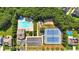 Community aerial view showing pool and tennis courts, surrounded by lush trees at 290 Prescott Dr, Acworth, GA 30101