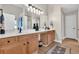 Bathroom features a double vanity with wood cabinets, large mirrors, and modern lighting at 290 Prescott Dr, Acworth, GA 30101