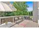 Relaxing deck with a table, chairs, bench, rug, grill, and a view of the backyard at 290 Prescott Dr, Acworth, GA 30101