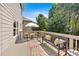 Relaxing deck with a table, chairs, bench, rug, and a view of the backyard at 290 Prescott Dr, Acworth, GA 30101