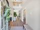 Bright and airy foyer showcasing hardwood floors, neutral walls, and a decorative wreath, leading to other rooms at 290 Prescott Dr, Acworth, GA 30101