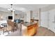 Kitchen island provides extra counter space in open-concept area; breakfast nook and living room shown at 290 Prescott Dr, Acworth, GA 30101