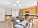 Open kitchen with stainless steel appliances, wood cabinets, and breakfast nook area at 290 Prescott Dr, Acworth, GA 30101