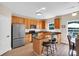 Spacious kitchen with stainless steel appliances, granite countertops, wooden cabinets, and an island at 290 Prescott Dr, Acworth, GA 30101