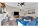 Inviting living room featuring a blue sectional sofa, fireplace, and stylish decor at 290 Prescott Dr, Acworth, GA 30101