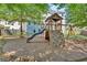 Backyard playground featuring a slide, climbing wall, and swings provides outdoor fun at 290 Prescott Dr, Acworth, GA 30101