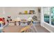 Bright playroom featuring built-in storage, shelving, and a large window, perfect for creative play and organization at 290 Prescott Dr, Acworth, GA 30101