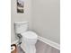 Cozy powder room features a modern toilet and painted in neutral colors at 290 Prescott Dr, Acworth, GA 30101