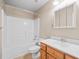Bright bathroom with white vanity, mirror, and tub/shower combination at 412 Gray Fox Dr, Canton, GA 30114