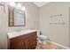 Bathroom featuring modern fixtures and a sleek vanity with dark wood cabinets at 412 Gray Fox Dr, Canton, GA 30114