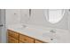 Bathroom featuring a double vanity with wooden cabinets and modern fixtures at 412 Gray Fox Dr, Canton, GA 30114