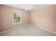 Neutral bedroom with window offering natural light at 412 Gray Fox Dr, Canton, GA 30114