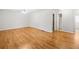 Large bedroom with hardwood flooring, neutral walls, and multiple doorways at 412 Gray Fox Dr, Canton, GA 30114