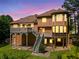 Back of home shows large deck and a wall of windows bringing the outside in at 412 Gray Fox Dr, Canton, GA 30114