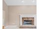 Living area featuring a stone fireplace and classic white mantel offering a cozy ambiance at 412 Gray Fox Dr, Canton, GA 30114