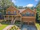 Two-story home featuring a covered porch and attached two-car garage at 412 Gray Fox Dr, Canton, GA 30114