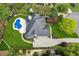 Aerial view of the home with well-manicured landscaping and a luxurious pool at 6455 Darely Ct, Cumming, GA 30040